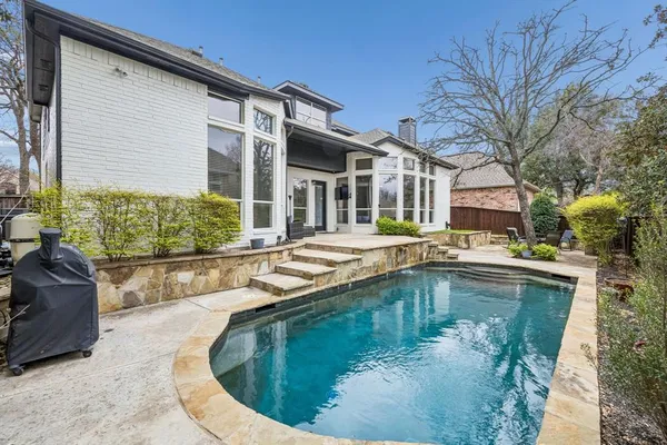 a view of a house with swimming pool