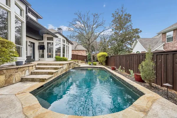 a view of a house with swimming pool