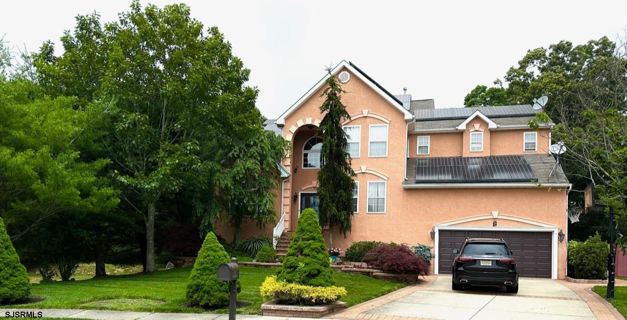 9 Ruth Court Absecon, NJ 08201 - Photo 1 of 38 a front view of a house with a garden
