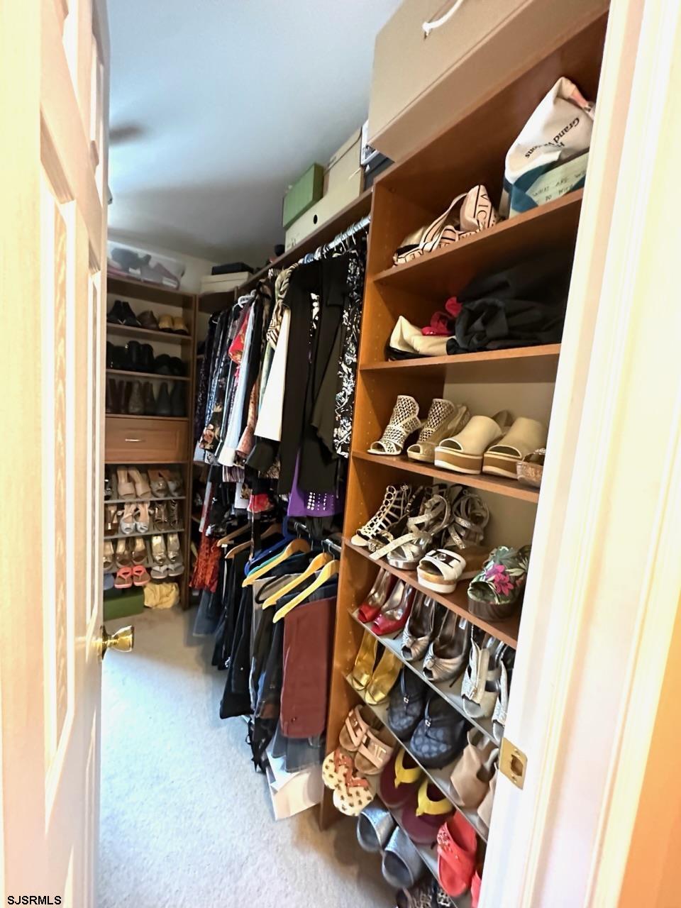 9 Ruth Court Absecon, NJ 08201 - Photo 11 of 38 walk in closet with clothes and shoes