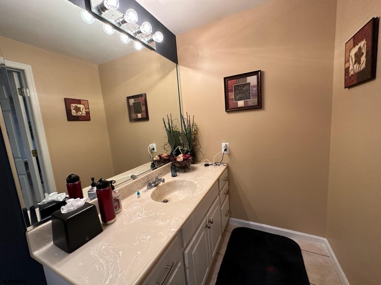 9 Ruth Court Absecon, NJ 08201 - Photo 14 of 38 a bathroom with a sink a mirror and a toilet