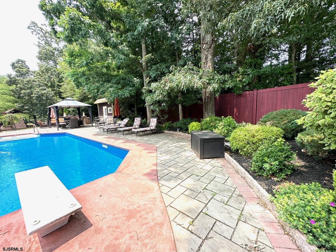 9 Ruth Court Absecon, NJ 08201 - Photo 31 of 38 a view of a swimming pool with a patio