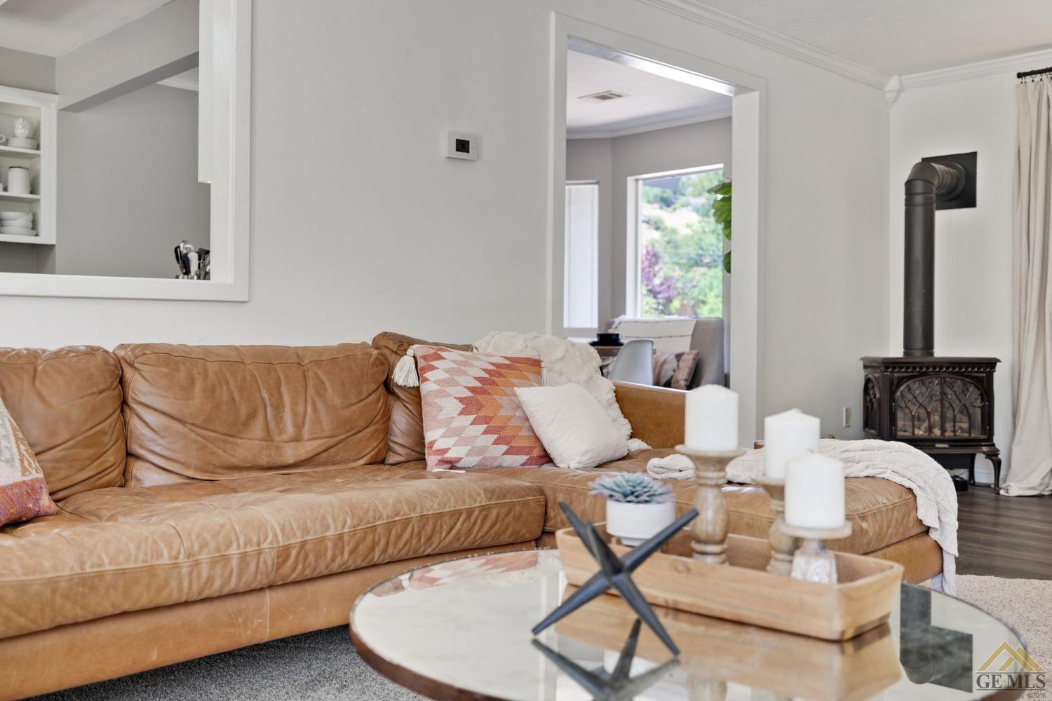 Undisclosed Address Tehachapi, CA 93561 - Photo 16 of 57 a living room with a couch and a dining table