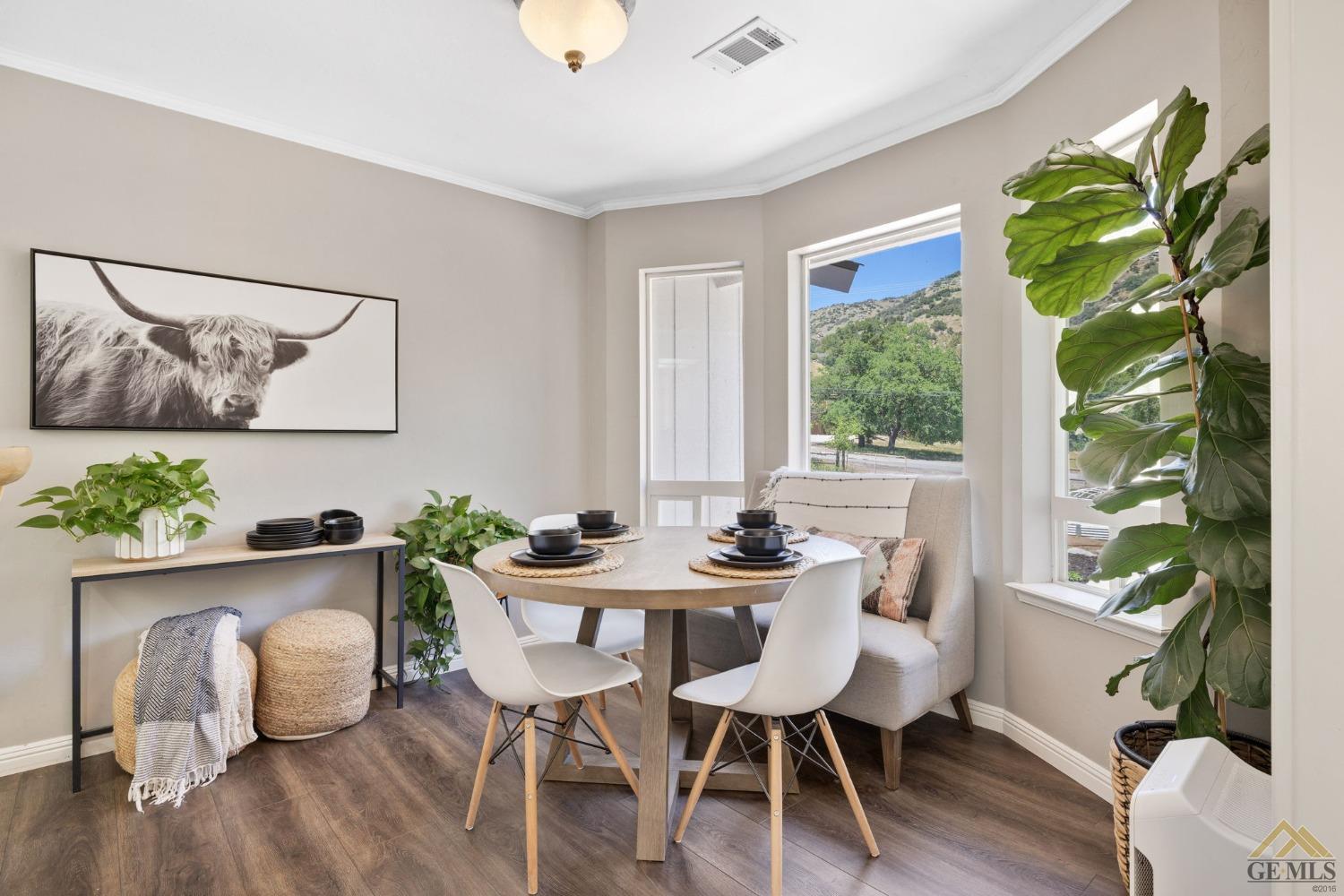Undisclosed Address Tehachapi, CA 93561 - Photo 18 of 57 a view of a dining room with furniture window and wooden floor