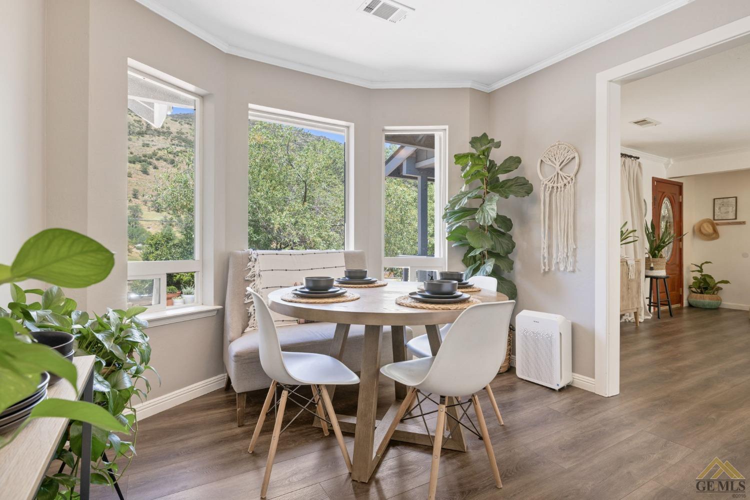 Undisclosed Address Tehachapi, CA 93561 - Photo 19 of 57 a view of a dining room with furniture window and wooden floor