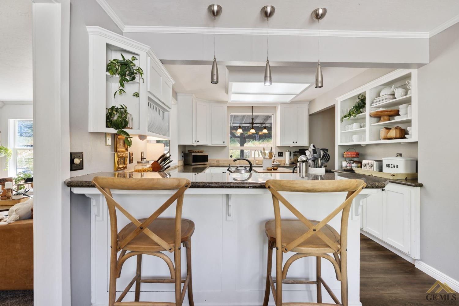 Undisclosed Address Tehachapi, CA 93561 - Photo 20 of 57 a kitchen with stainless steel appliances a table and chairs in it