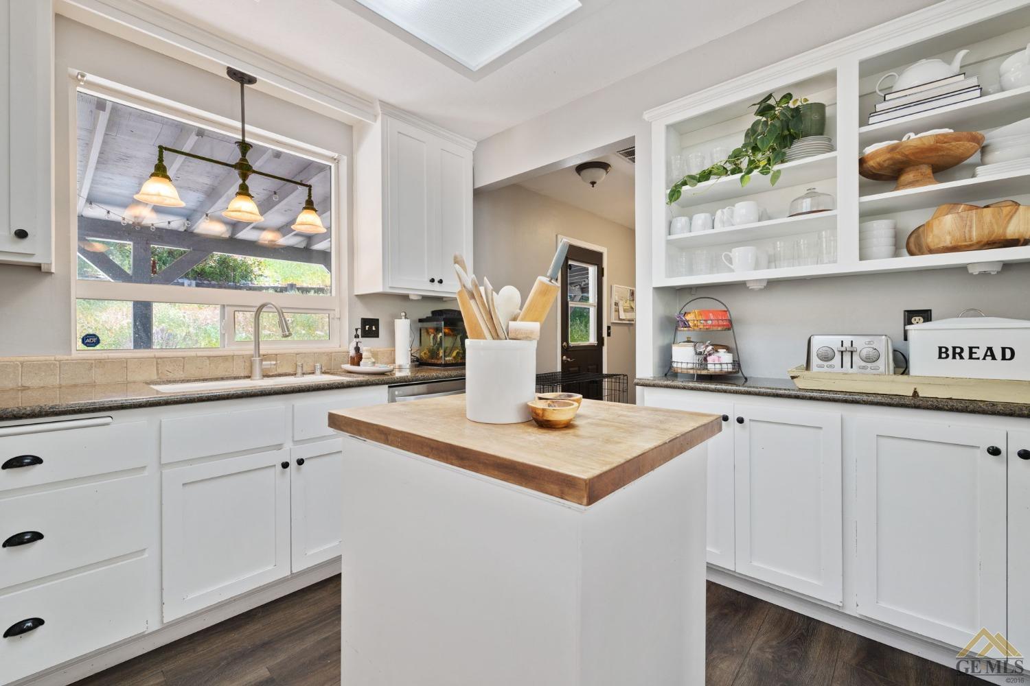 Undisclosed Address Tehachapi, CA 93561 - Photo 24 of 57 a kitchen with sink cabinets and window
