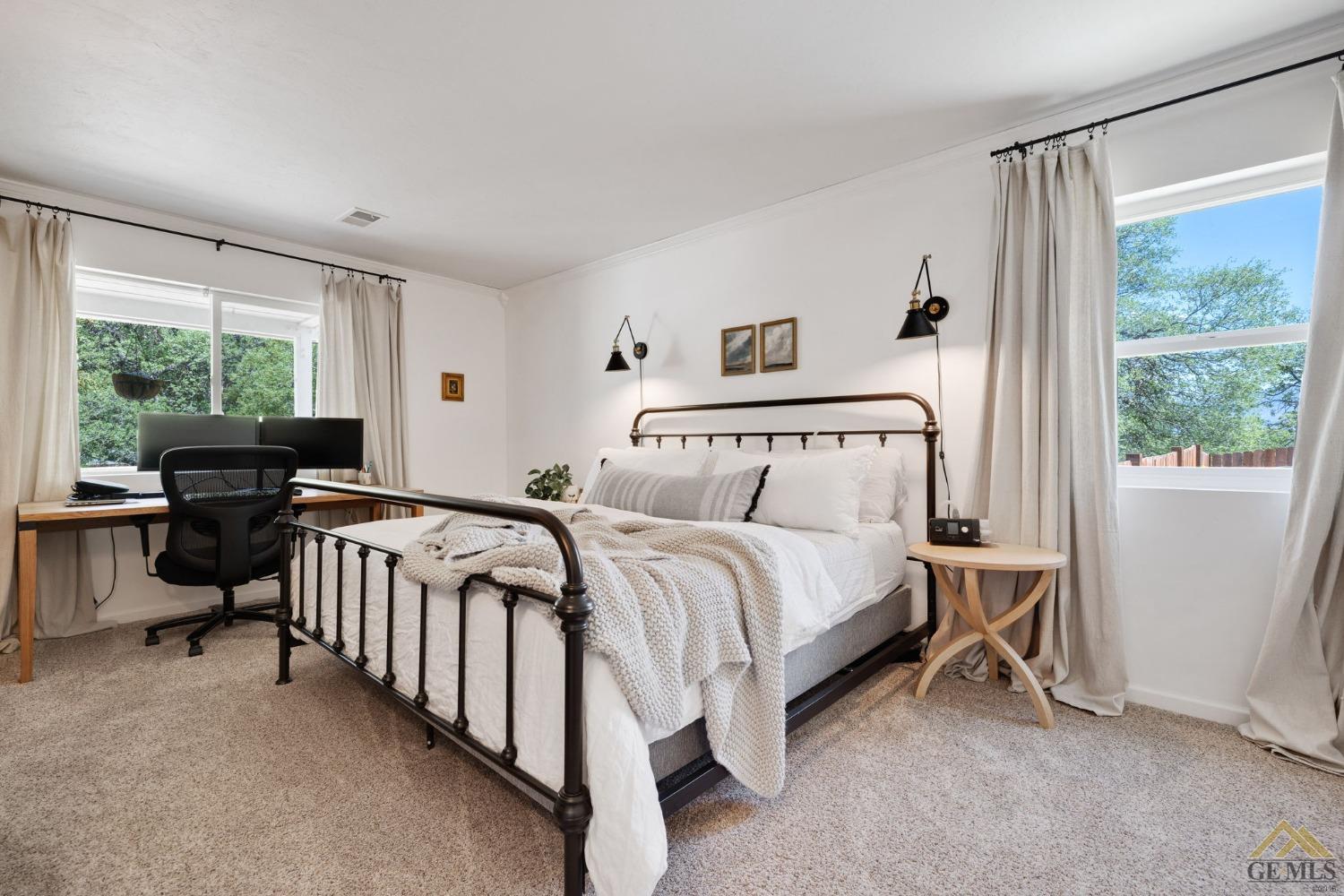 Undisclosed Address Tehachapi, CA 93561 - Photo 27 of 57 a bed room with a bed and a large window