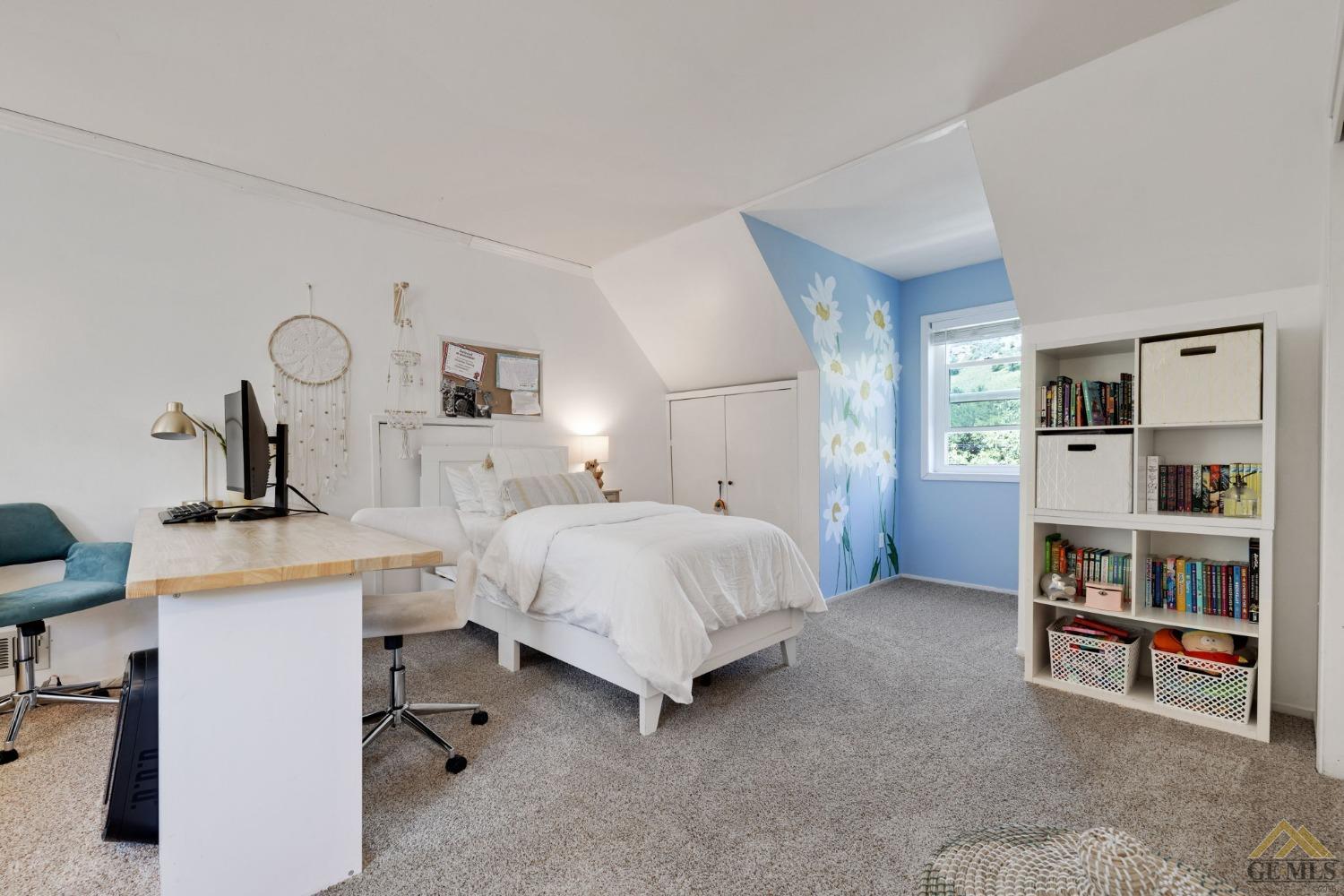 Undisclosed Address Tehachapi, CA 93561 - Photo 34 of 57 a bed room with a bed and a book shelf