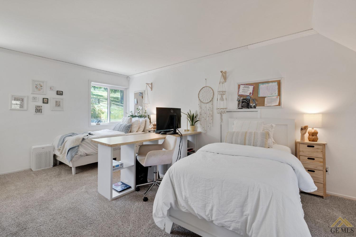 Undisclosed Address Tehachapi, CA 93561 - Photo 35 of 57 a room with a bed and a flat screen tv