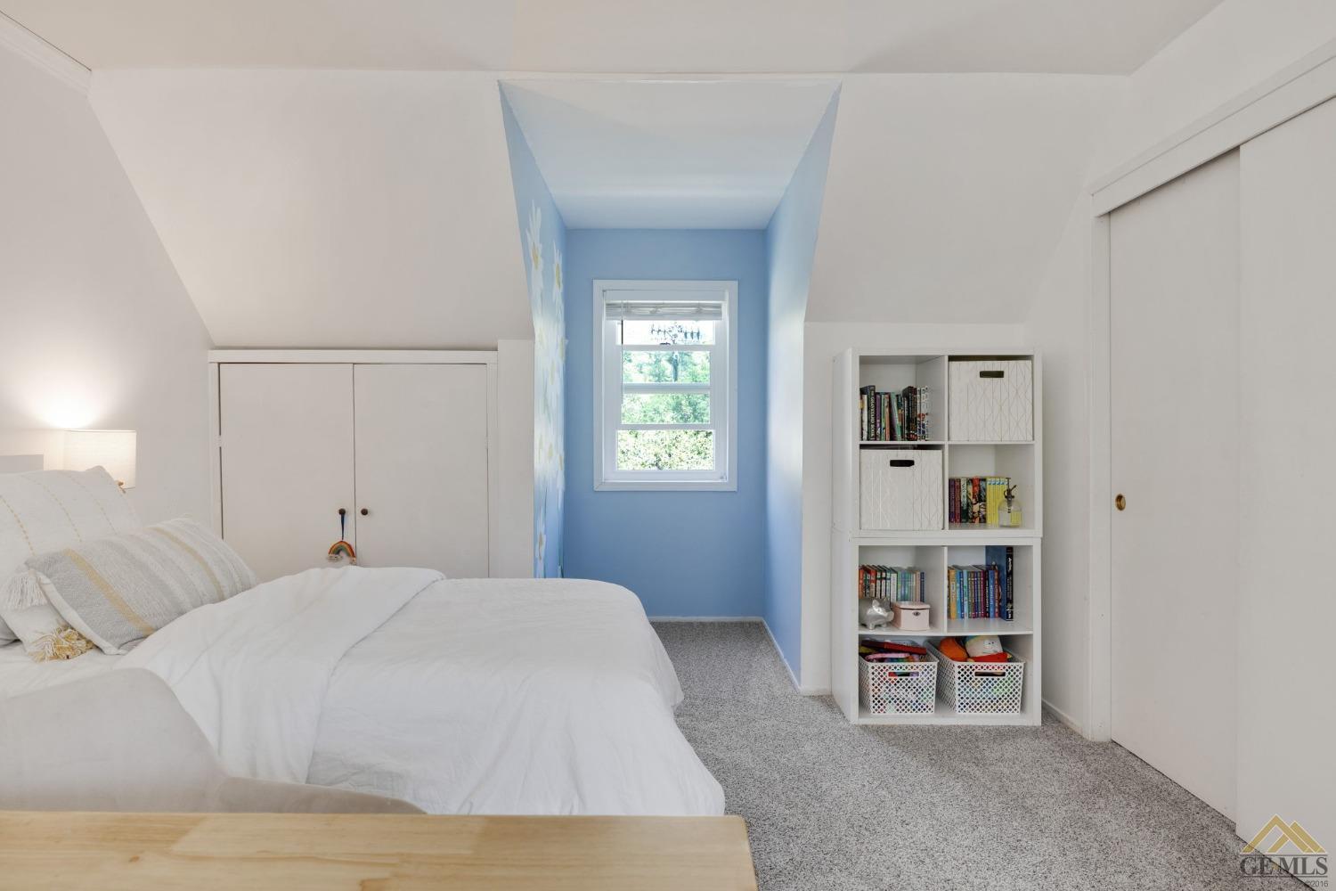 Undisclosed Address Tehachapi, CA 93561 - Photo 36 of 57 a bedroom with a bed and a book shelf