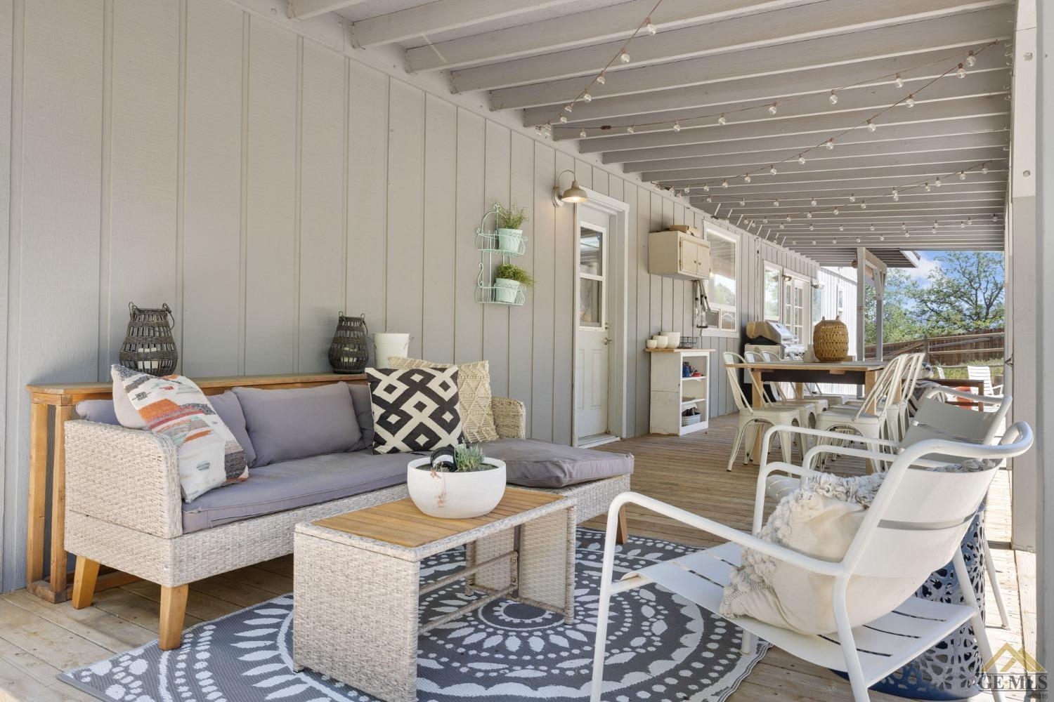 Undisclosed Address Tehachapi, CA 93561 - Photo 40 of 57 a living room with furniture and a chandelier