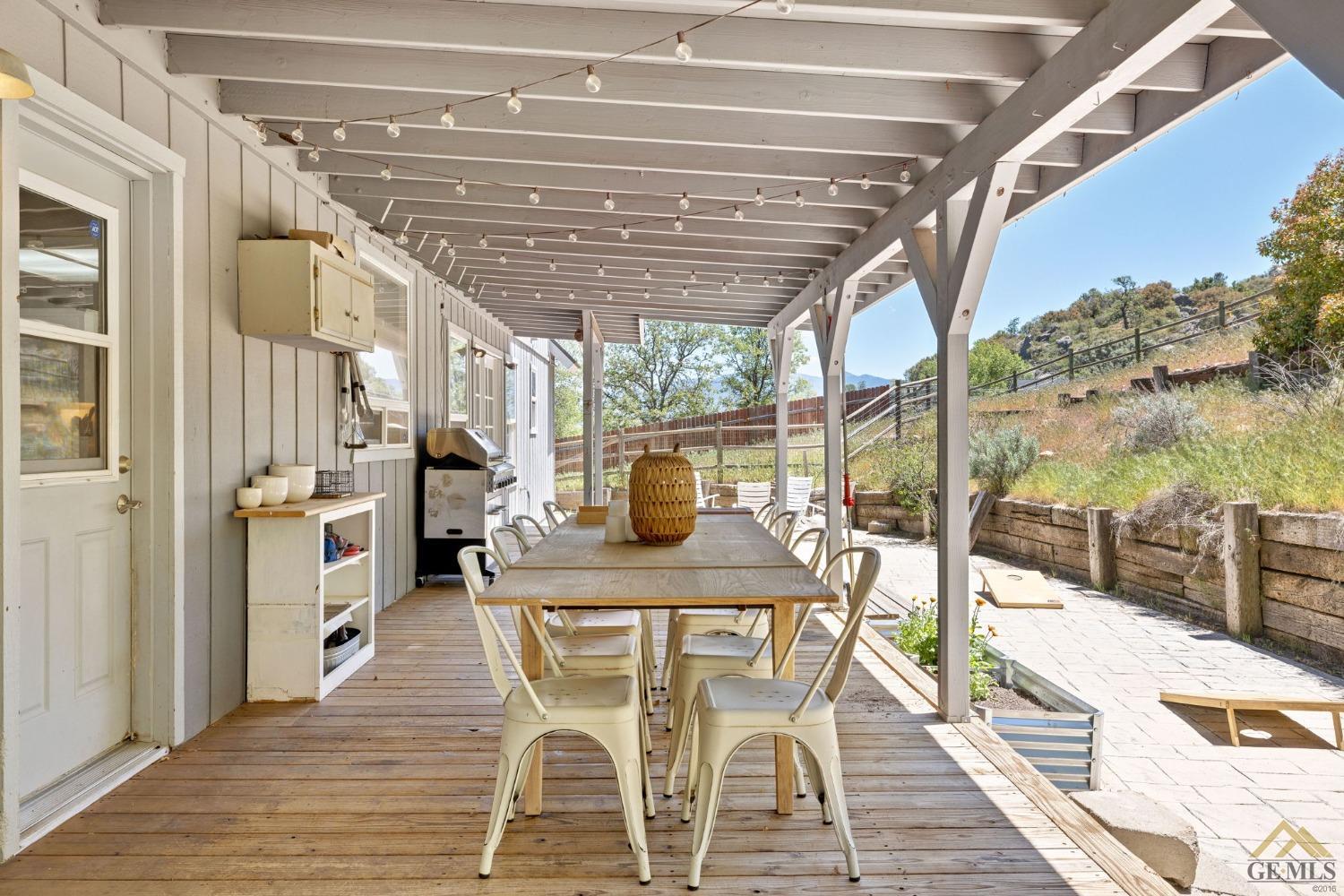 Undisclosed Address Tehachapi, CA 93561 - Photo 41 of 57 a patio with a table and chairs