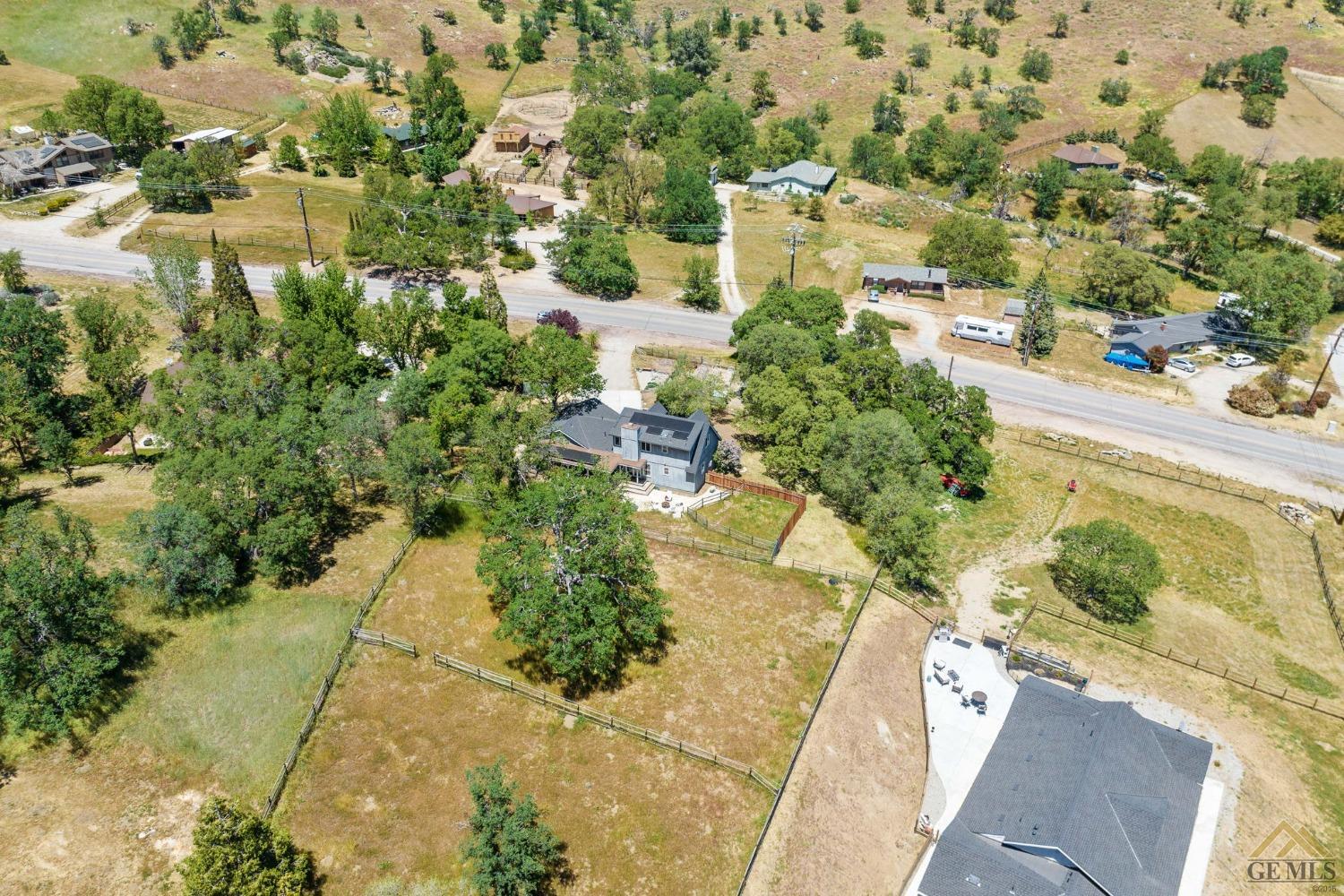 Undisclosed Address Tehachapi, CA 93561 - Photo 45 of 57 a view of a yard with plants and large trees