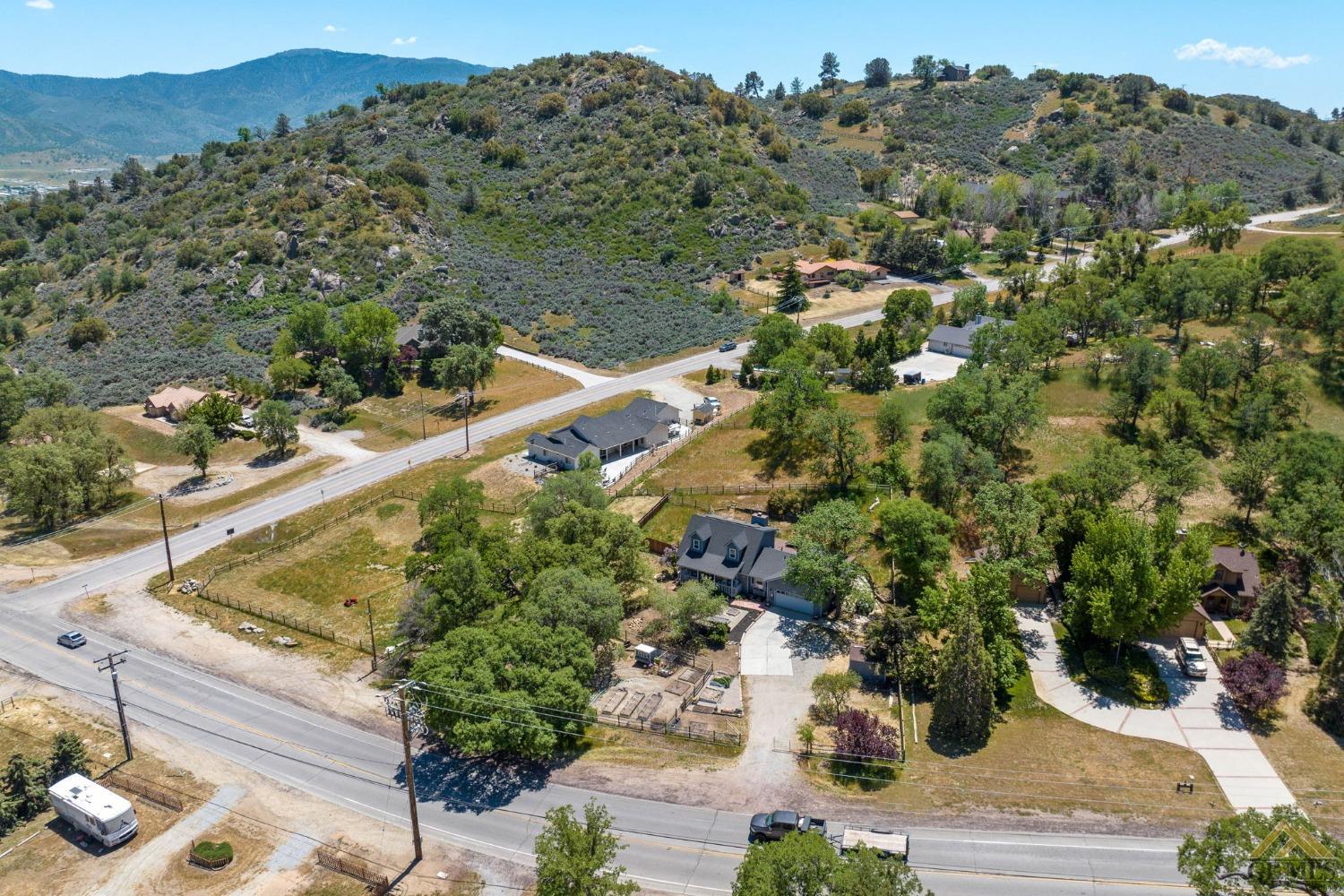 Undisclosed Address Tehachapi, CA 93561 - Photo 48 of 57 a view of a house with a mountain and a forest