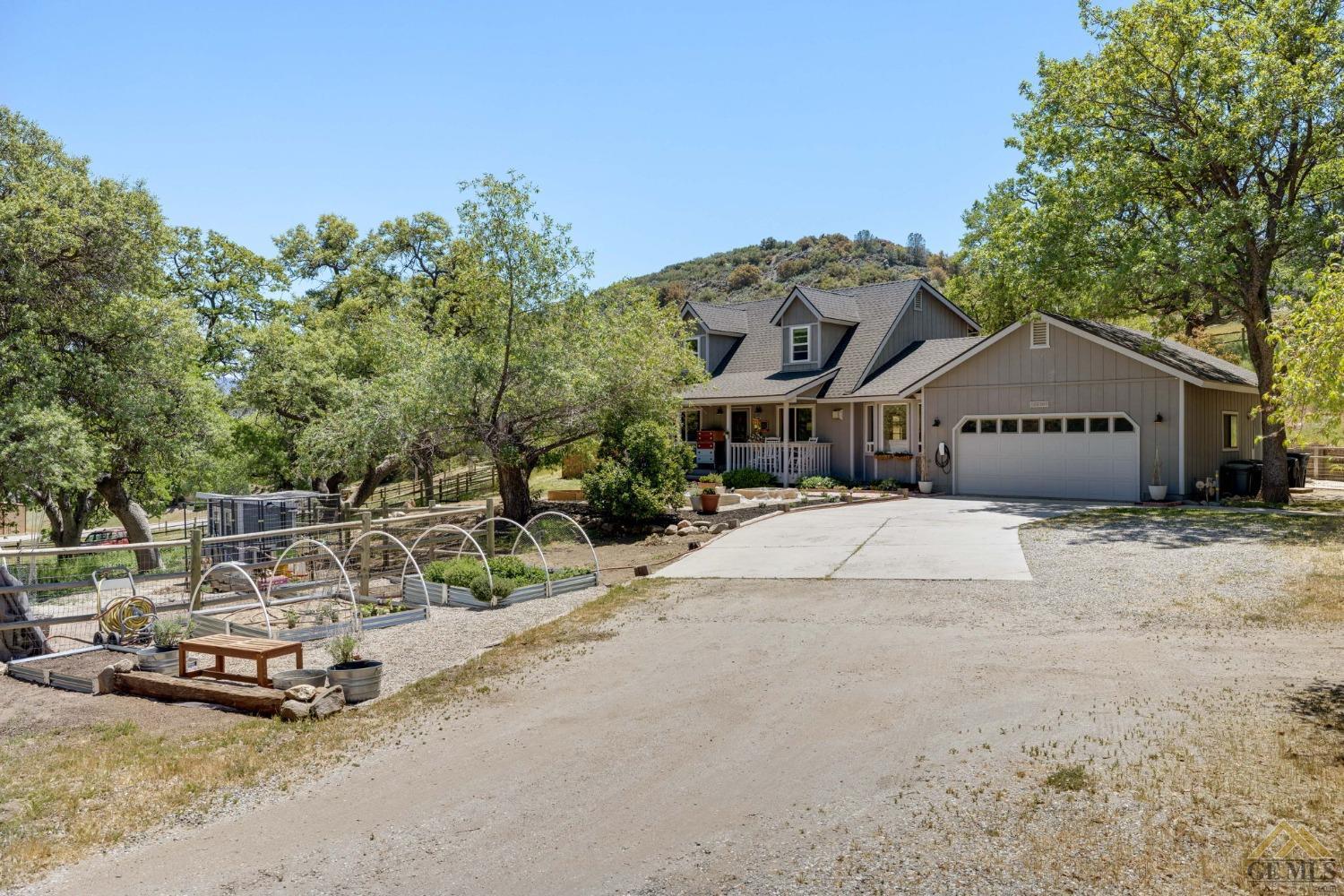 Undisclosed Address Tehachapi, CA 93561 - Photo 5 of 57 a front view of a house with a yard