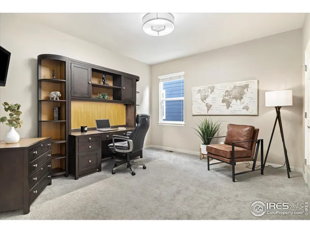 a workspace with furniture and window