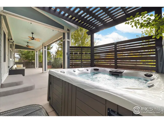 a bathroom with a granite countertop sink and a large window