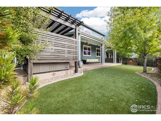 a view of a house with a yard porch and sitting area