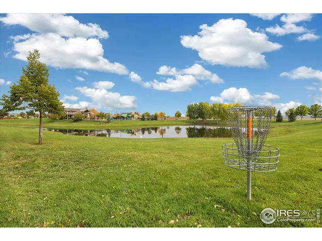 a view of a golf course with a lake