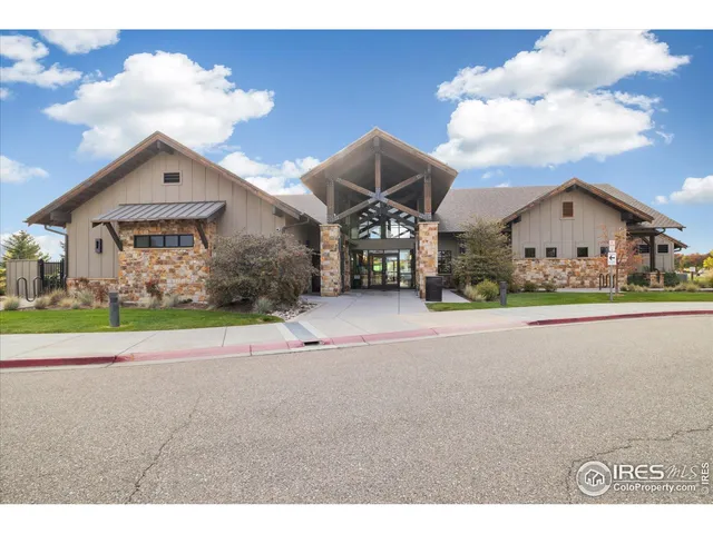 a view of a house with a yard and garage
