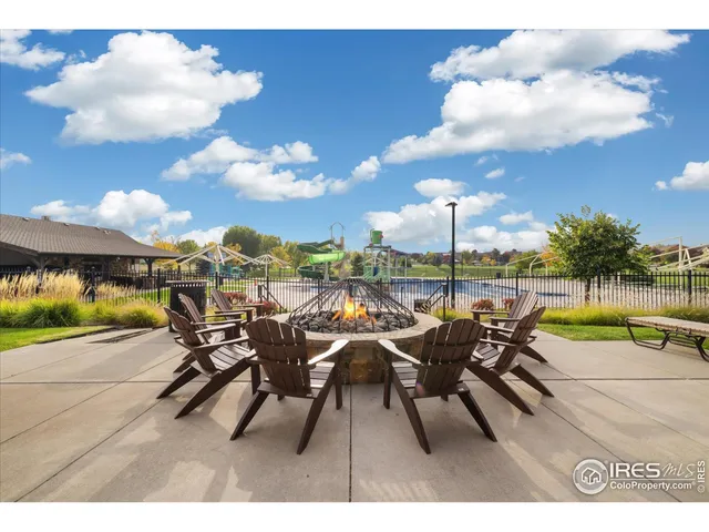 a view of a chairs and table in patio