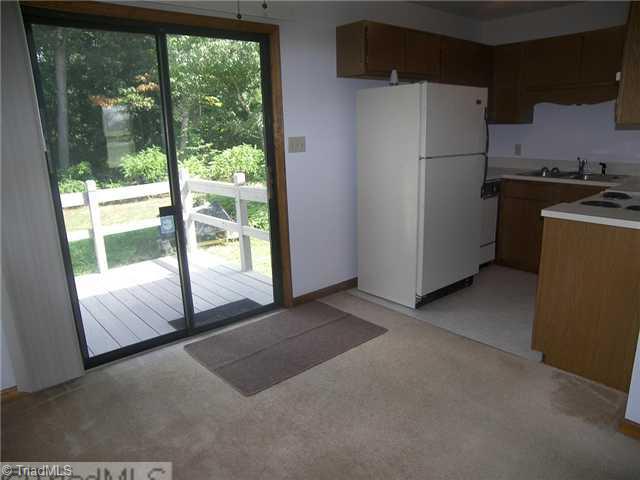 983 Ridgeview Avenue Winston-Salem, NC 27127 - Photo 3 of 13 Kitchen. Dining Area opens up to the back deck