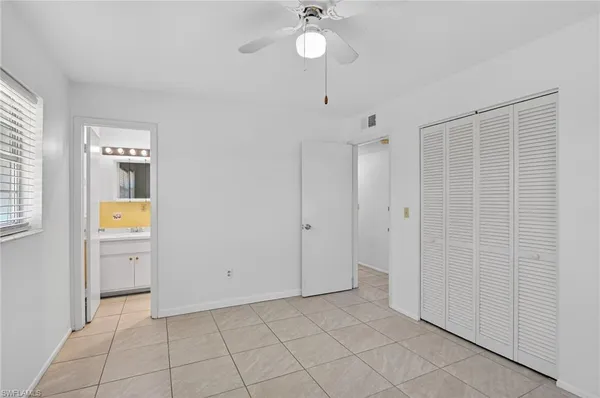 a view of an empty room with a fan