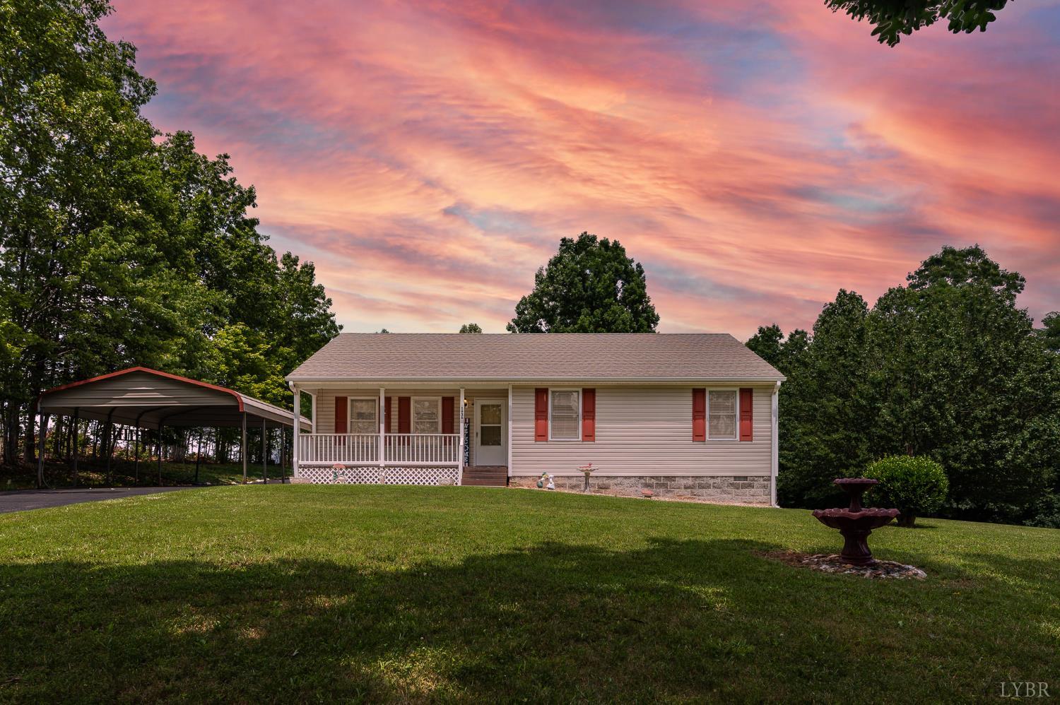 1936 Bear Creek Road Rustburg, VA 24588 - Photo 1 of 44 a front view of a house with garden