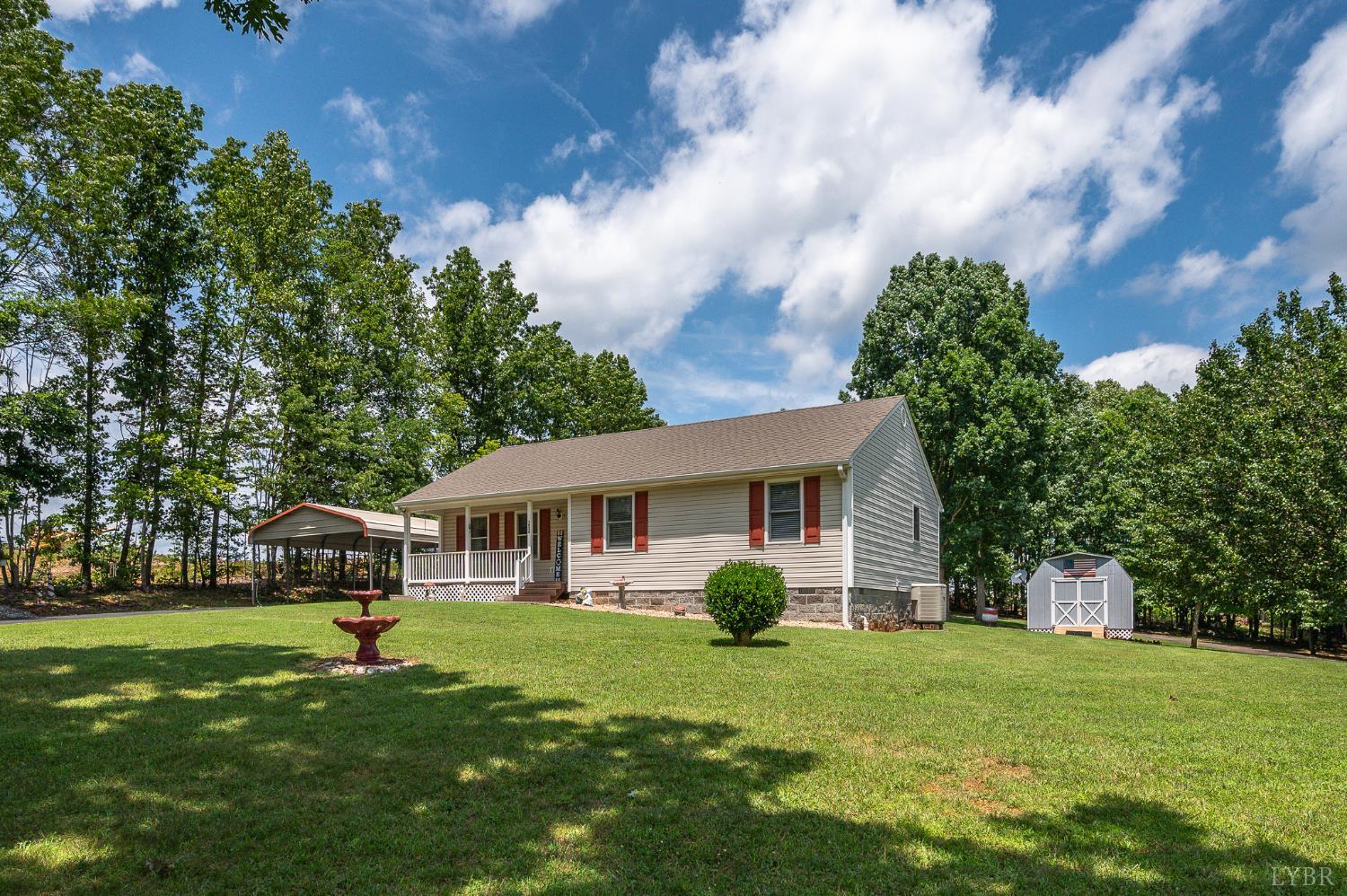 1936 Bear Creek Road Rustburg, VA 24588 - Photo 30 of 44 a view of a house with a backyard