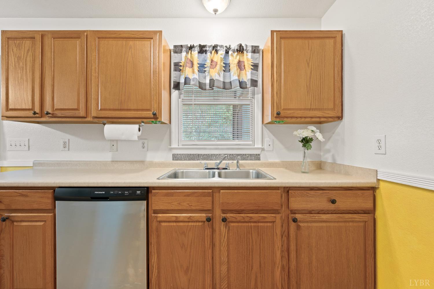 1936 Bear Creek Road Rustburg, VA 24588 - Photo 8 of 44 a kitchen with a sink and cabinets