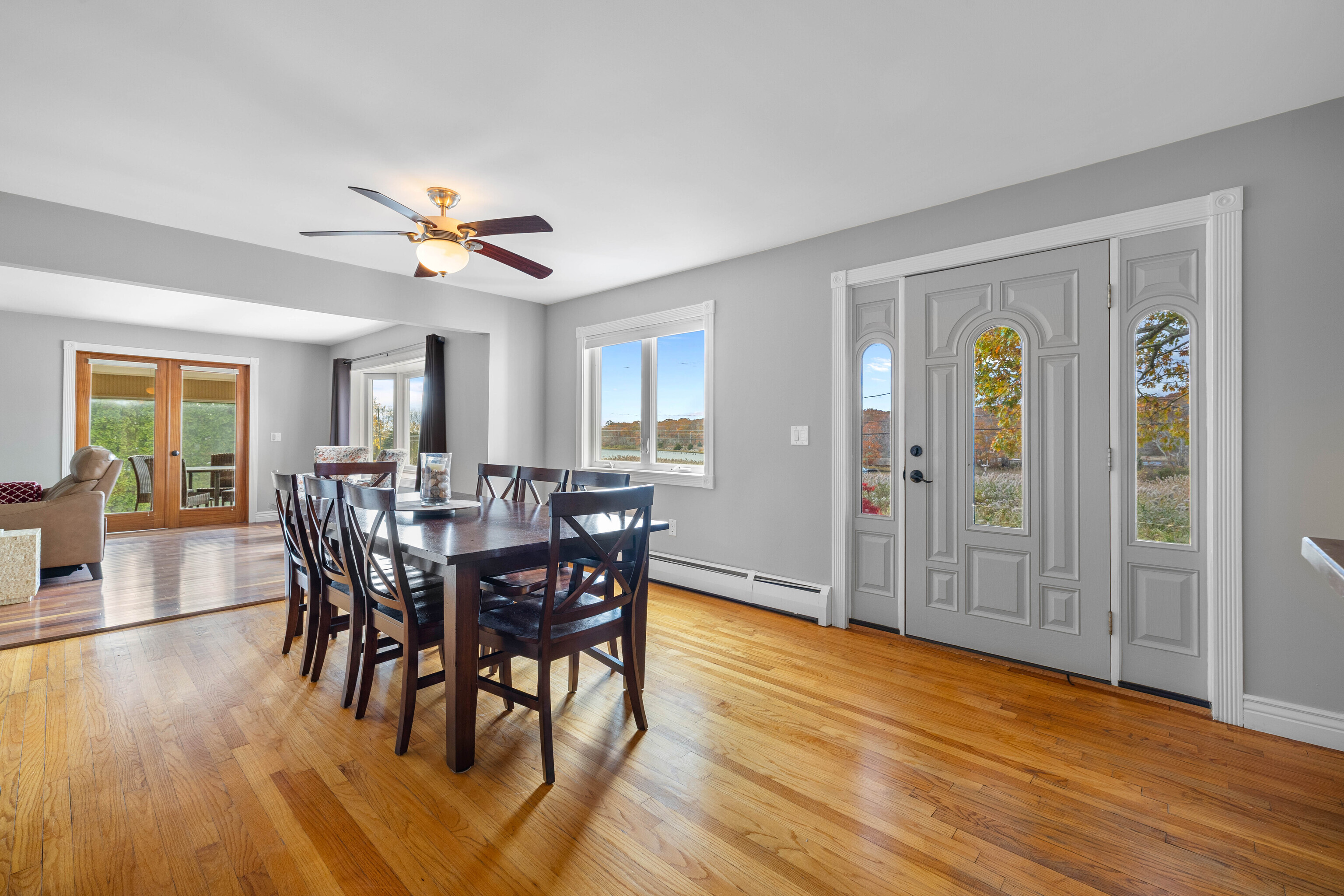 46 Old Black Point Road East Lyme, CT 06357 - Photo 11 of 40 a view of a a dining room with furniture window and wooden floor