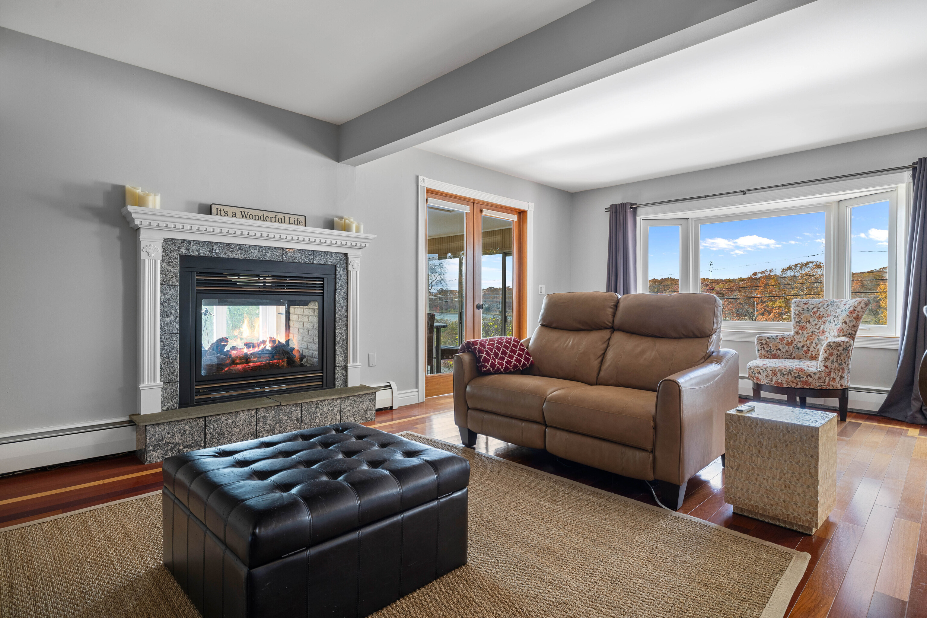 46 Old Black Point Road East Lyme, CT 06357 - Photo 15 of 40 a living room with furniture and a fireplace