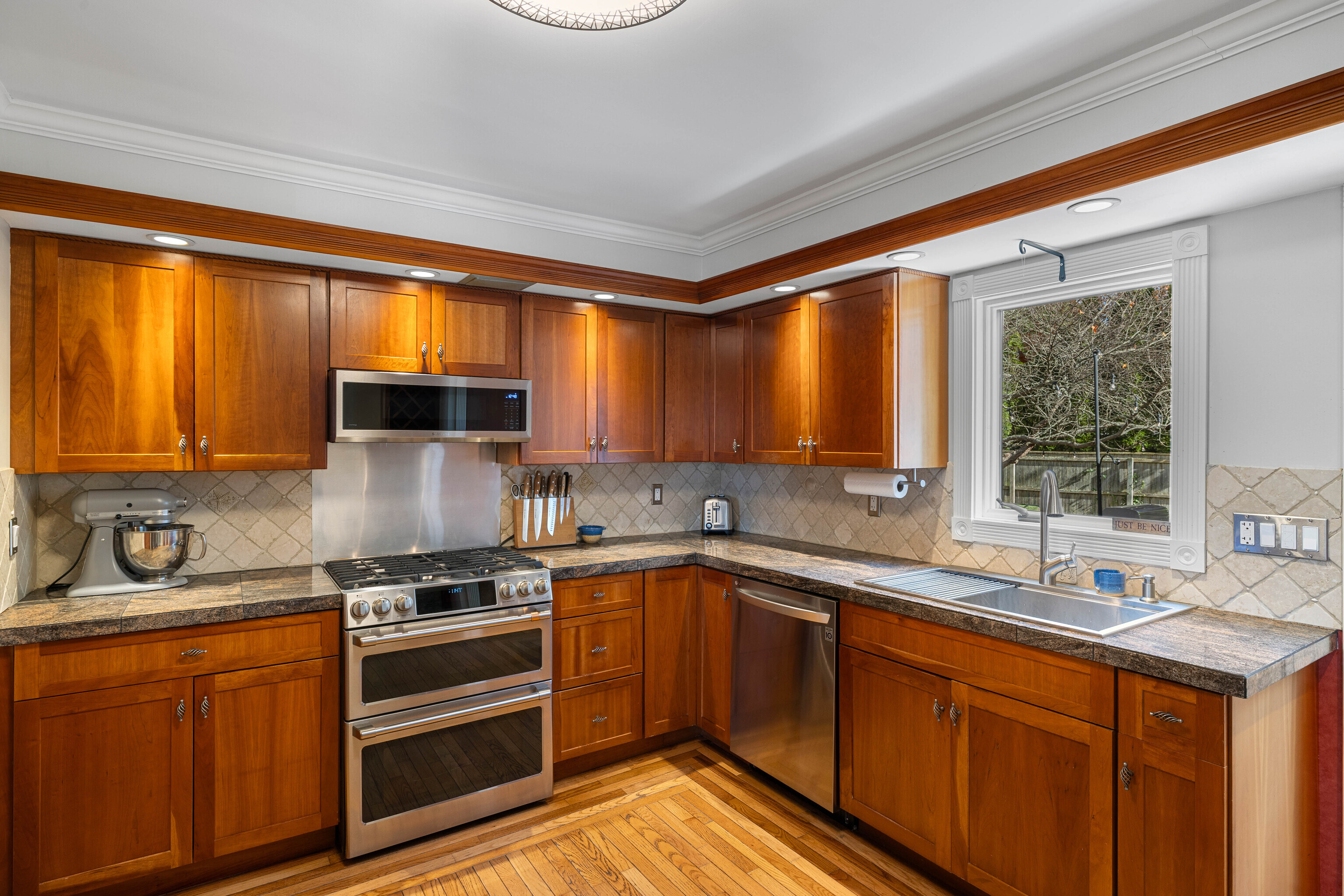 46 Old Black Point Road East Lyme, CT 06357 - Photo 17 of 40 a kitchen with stainless steel appliances a sink stove and cabinets