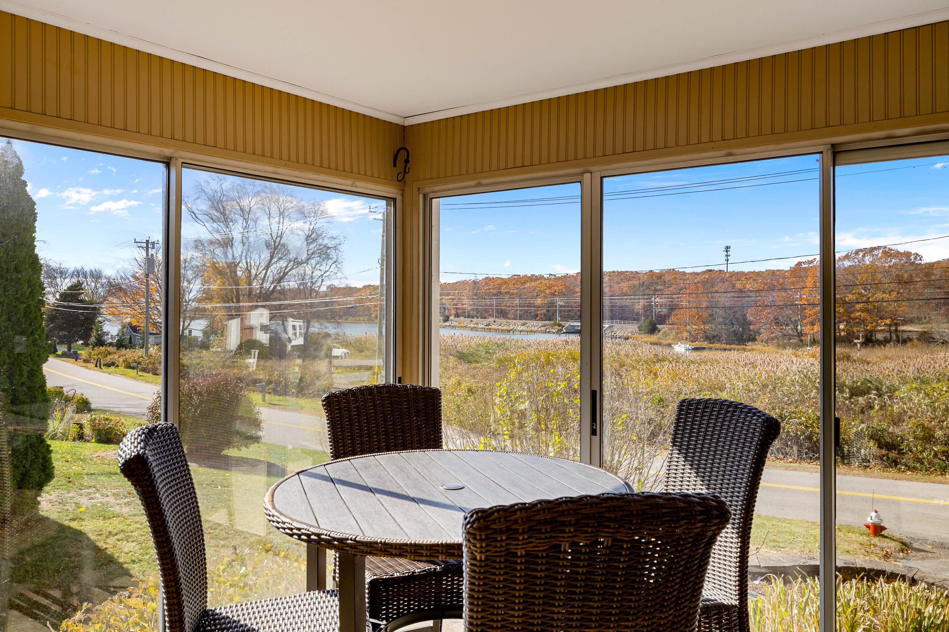46 Old Black Point Road East Lyme, CT 06357 - Photo 19 of 40 a view of a city from a dining room with a table or chairs