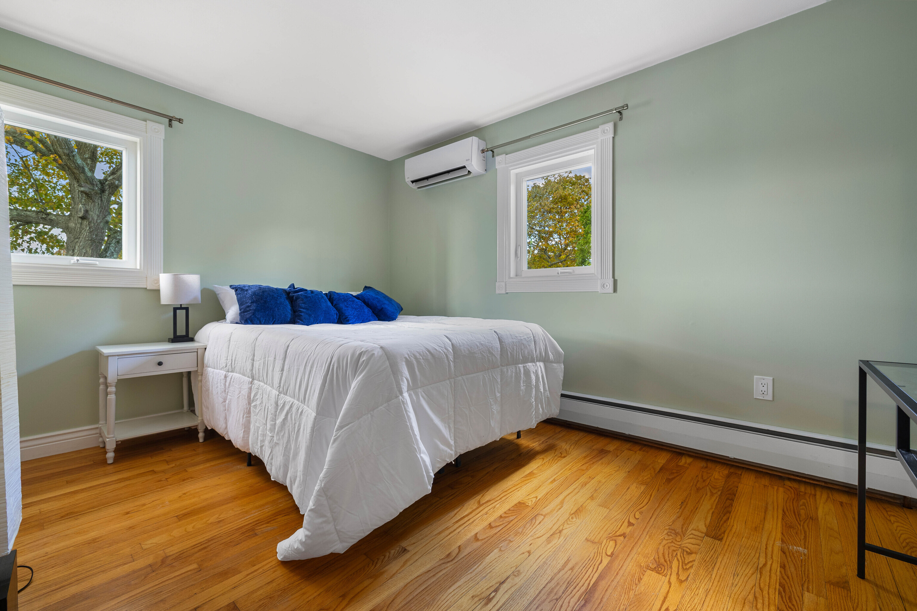 46 Old Black Point Road East Lyme, CT 06357 - Photo 22 of 40 a bedroom with a bed and a window
