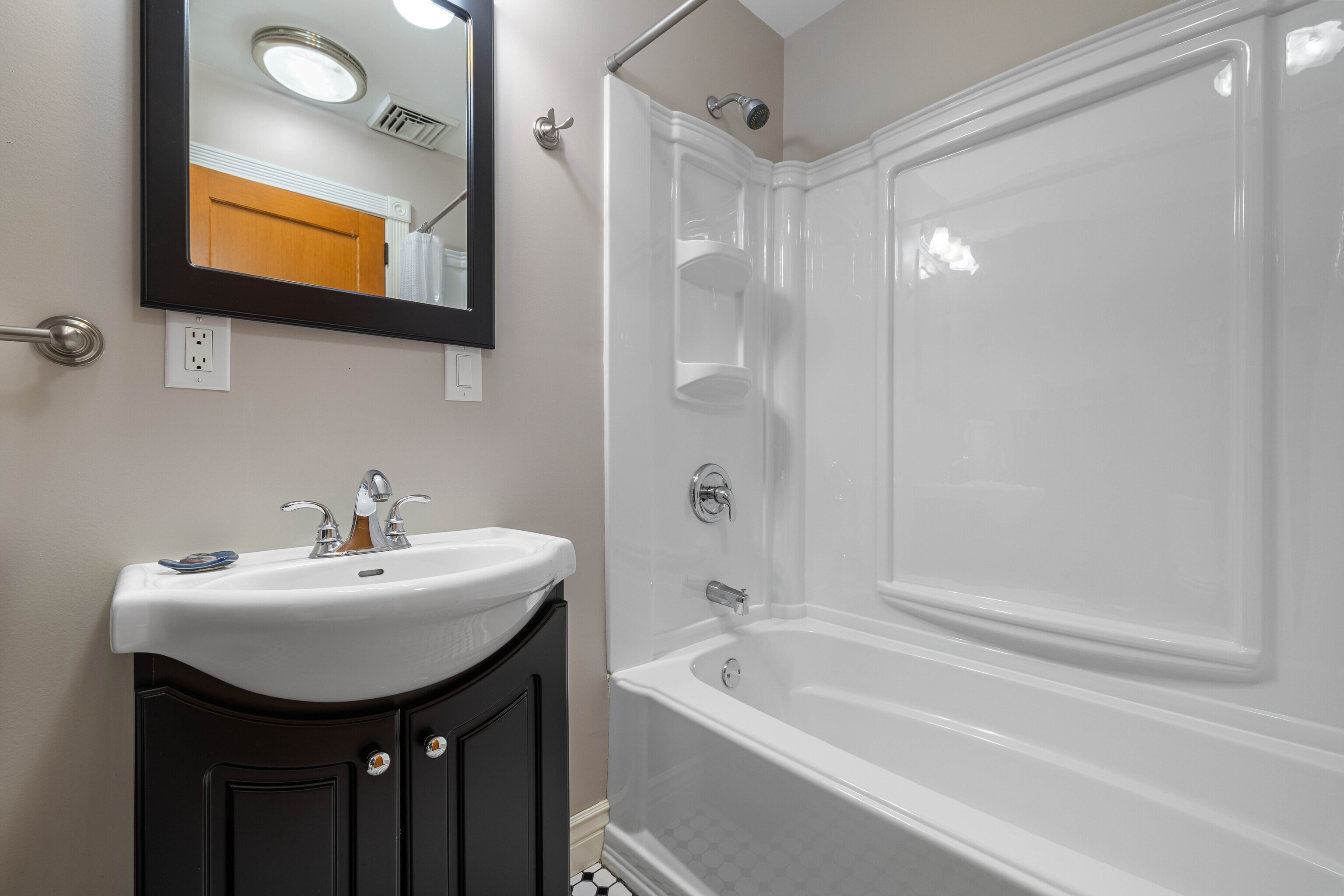 46 Old Black Point Road East Lyme, CT 06357 - Photo 29 of 40 a bathroom with a sink mirror and a bathtub