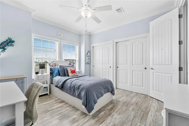 a bed room with a bed and a chair