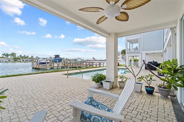 a view of swimming pool with outdoor seating