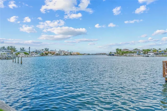 a view of a brick house with many windows