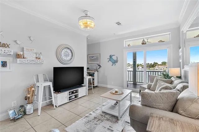 a view of a balcony with chairs and wooden floor