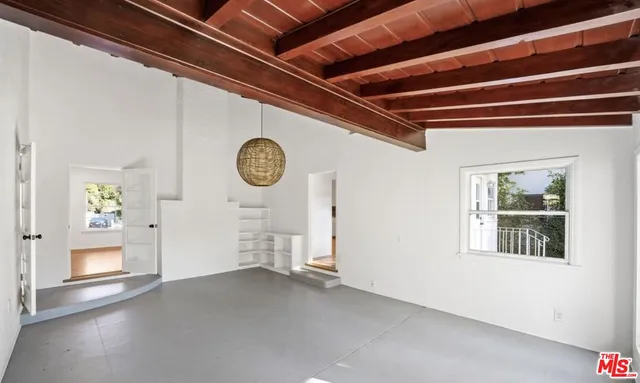 a view of a hallway with windows
