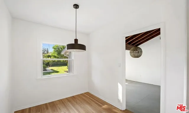 a view of an entryway with wooden floor