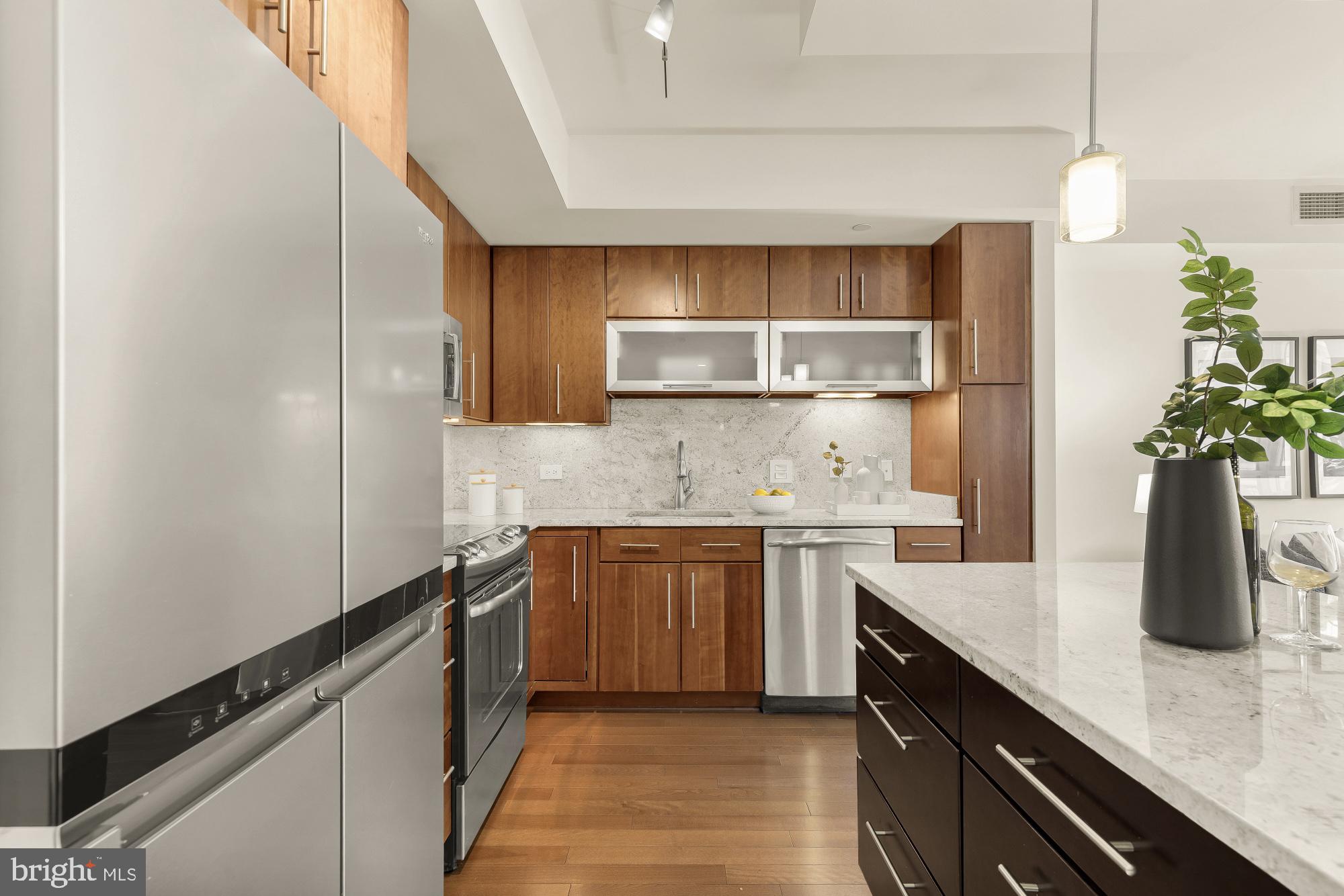 1025 First Street Southeast, Unit 510 Washington, DC 20003 - Photo 6 of 25 The kitchen features stainless steel appliances.