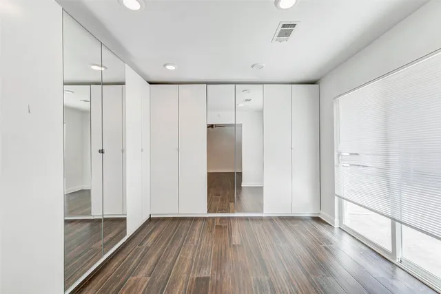 wooden floor in an empty room with an entryway