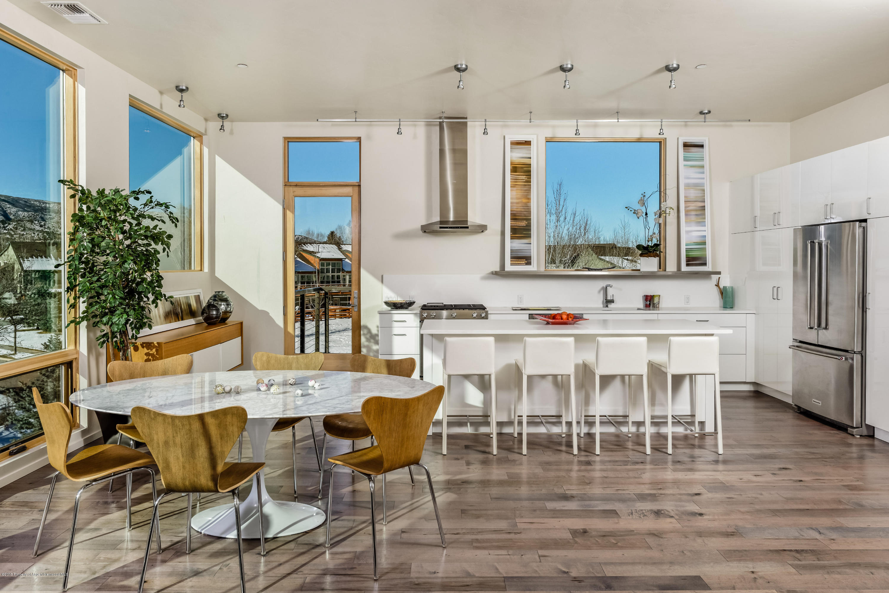 a view of kitchen with dining table and chairs