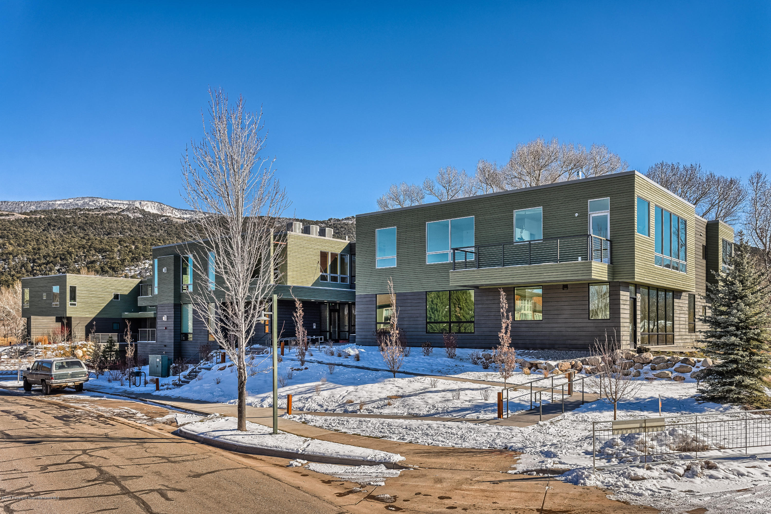 200 Evans Road, Unit 101 Basalt, CO 81621 - Photo 14 of 53 a front view of a house with a yard