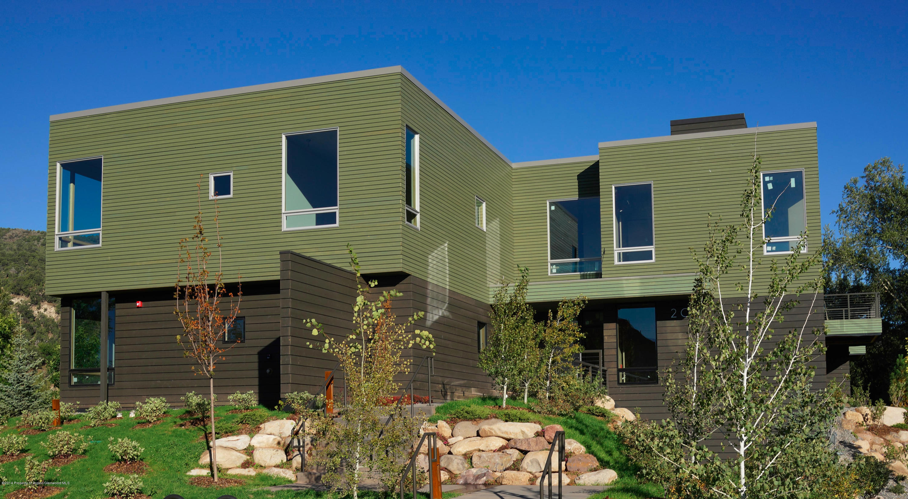 200 Evans Road, Unit 101 Basalt, CO 81621 - Photo 23 of 53 a front view of a house with a garden