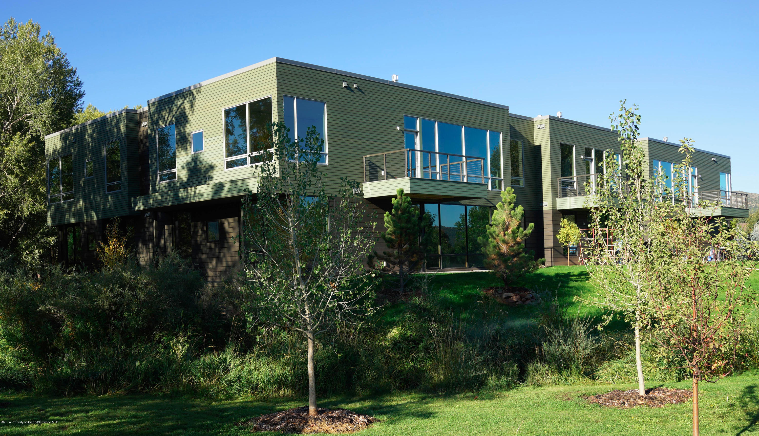 200 Evans Road, Unit 101 Basalt, CO 81621 - Photo 24 of 53 a front view of a house with yard and green space