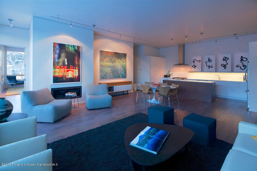 200 Evans Road, Unit 101 Basalt, CO 81621 - Photo 4 of 53 a living room with furniture and wooden floor